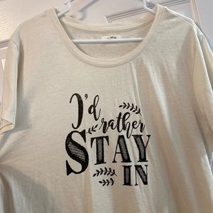 Cream colored short sleeve top “I’d rather stay in”